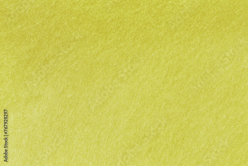 Yellow green felt texture abstract background. Surface of fabric texture in deep yellow color. 