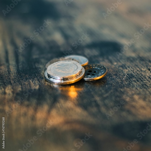 Closeup of British coins on a wooden surface