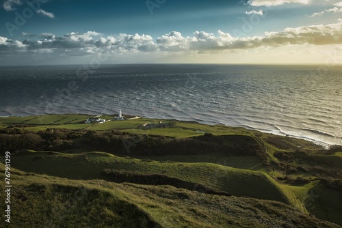 St Catherine's point in Isle of Wight island overlooking the ocean at sunset photo