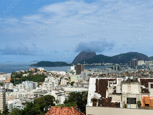 Beautiful view of Sugarloaf Mountain (Morro do Pão de Açúcar), Baia de Guanabara, Niterói, Morro dos Prazeres favela, from a viewpoint in Parque das Ruínas - Rio de Janeiro, Brazil