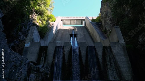 Low-angle of the water of Cleveland Dam coming down to the Capilano River in North Vancouver photo