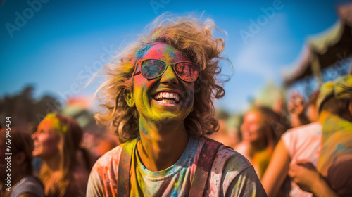 Smiling , laughing happy young woman in sunglasses. Party life.  Holi powder on her face and clothers. Concept Indian color Organic Gulal festival. Hindu tradition festive © alesia0604