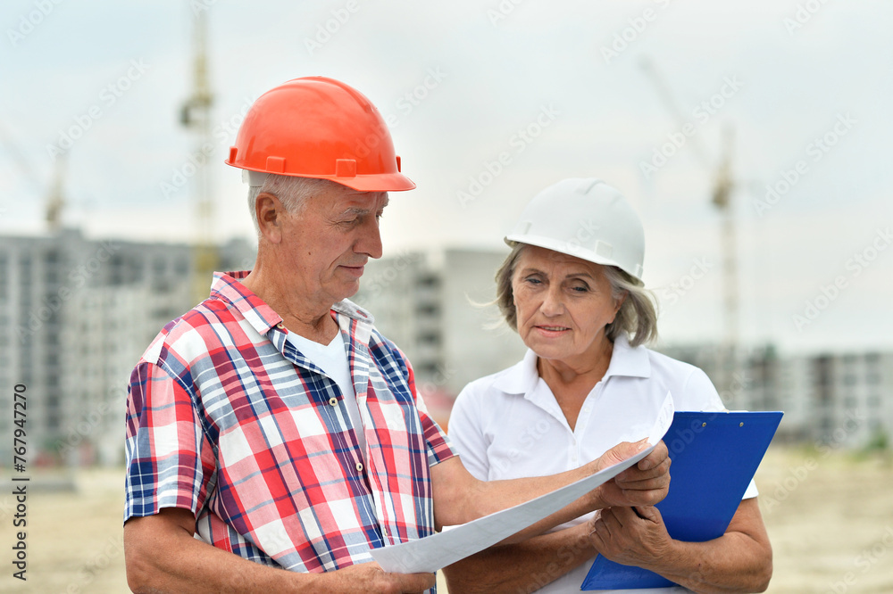 Fototapeta premium Portrait of senior couple in under construction