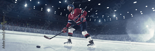 Dynamic image of competitive man, professional hockey player in uniform in motion during tournament, with puck and stick on 3d render ice rink. Concept of sport, competition, match, game, tournament
