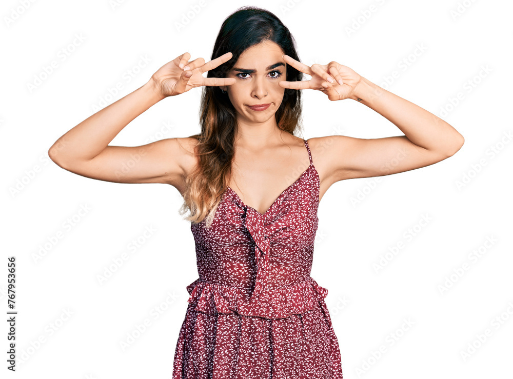 Beautiful hispanic woman wearing bohemian and hippie style doing peace symbol skeptic and nervous, frowning upset because of problem. negative person. Beautiful hispanic woman wearing bohemian and hippie style doing peace symbol skeptic and nervous, frowning upset because of problem. negative person.