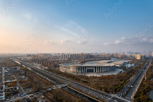 Photography Aerial shot of Tianjin Meijiang Convention and Exhibition Center, China at sunse