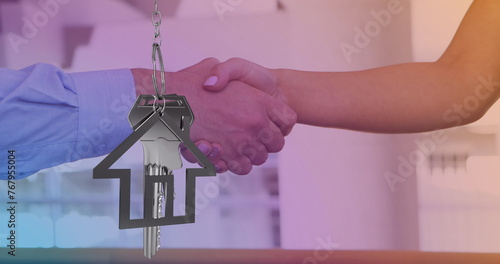 Image of keys and house icon over diverse people shaking hands