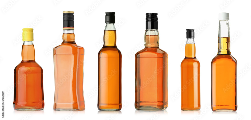 Many bottles of whiskey isolated on white, set Many bottles of whiskey isolated on white, set