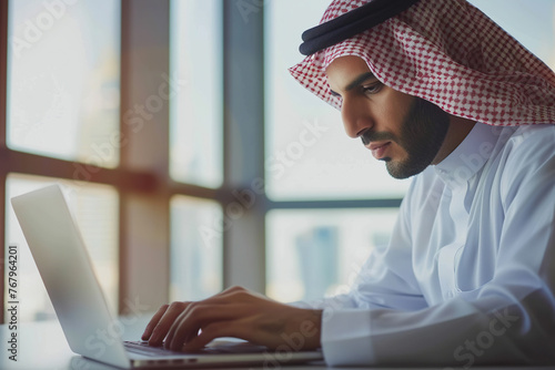 Pensive CEO solving problem on business trip closeup. Focused Arab typing laptop