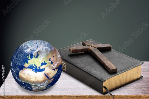 Globe model and Holy Bible book for mission