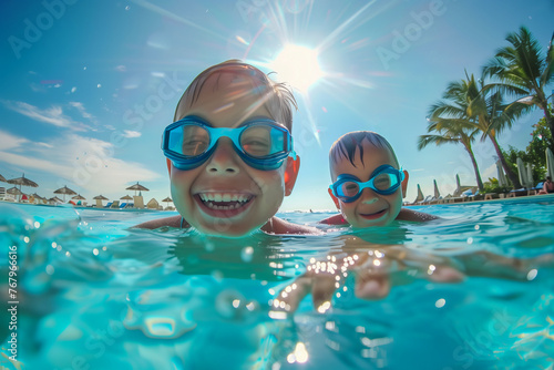 Children are swimming and playing in a pool © Juha Saastamoinen