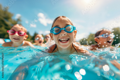 Children are swimming and playing in a pool