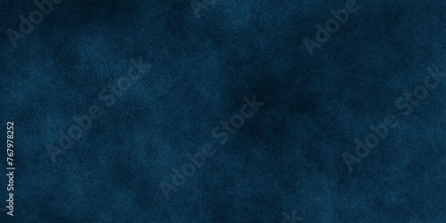 Abstract dark background grunge navy blue textrue. Blue stone grain background with copy space. vintage paper background with a dark blue vignette. night space view blue smoke cloud textrue.