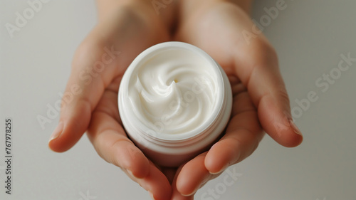 woman showing cream for skin care