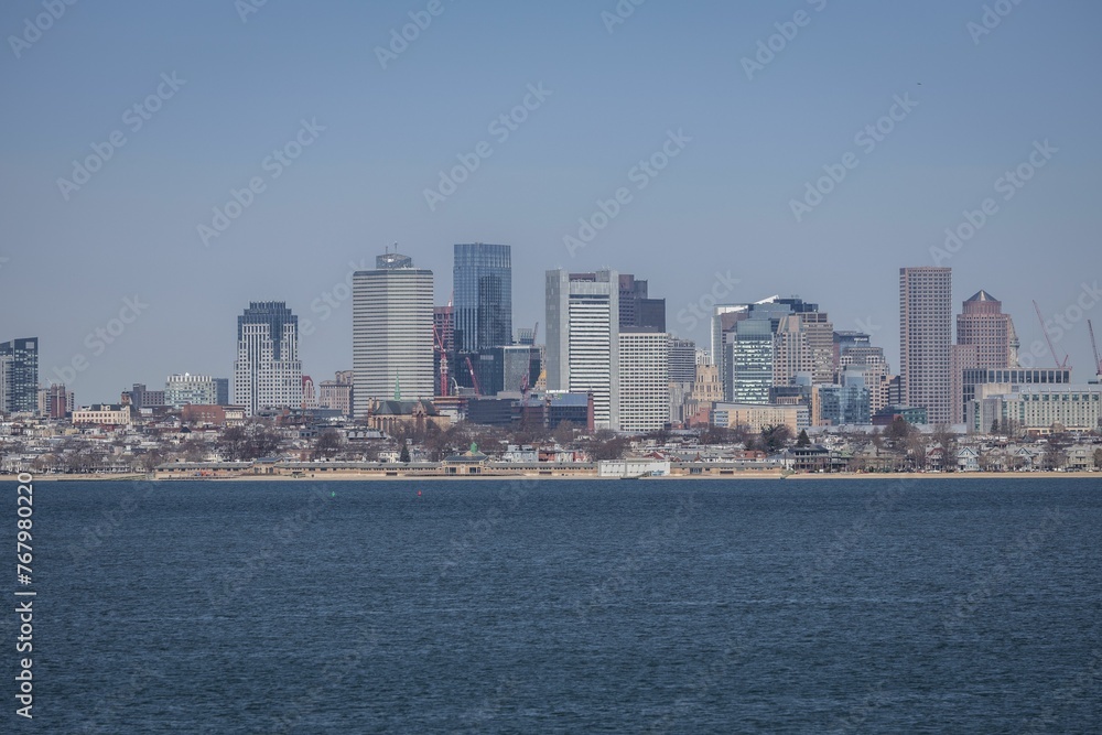 Stunning aerial view of the Boston city skyline with Boston harbor in the foreground