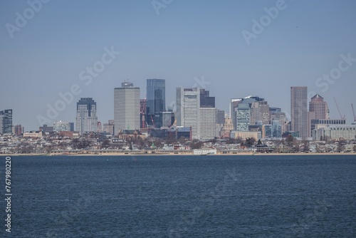 Stunning aerial view of the Boston city skyline with Boston harbor in the foreground © Wirestock