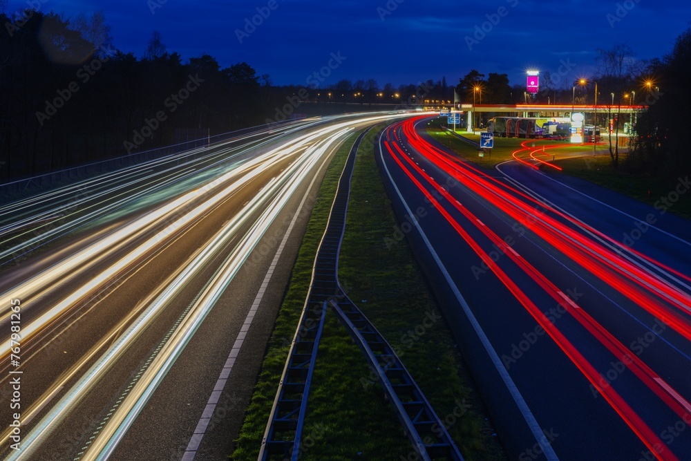 City street illuminated by a myriad of light trails in various directions