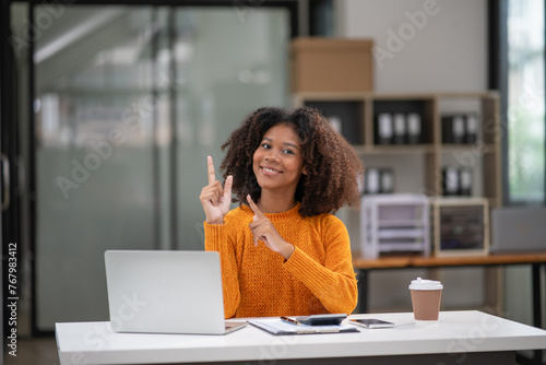 Businesswoman talking to customers online together at the office.