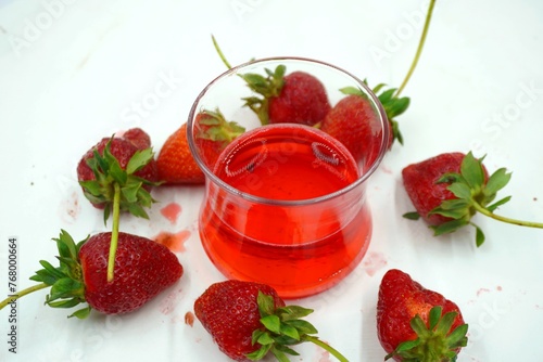 Delicious Strawberry Juice In Glass. Healthy Refreshing Summer Cocktail. Strawberry Juice and Strawberry on white background