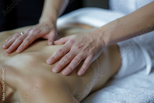 Close-up of a back massage therapy session