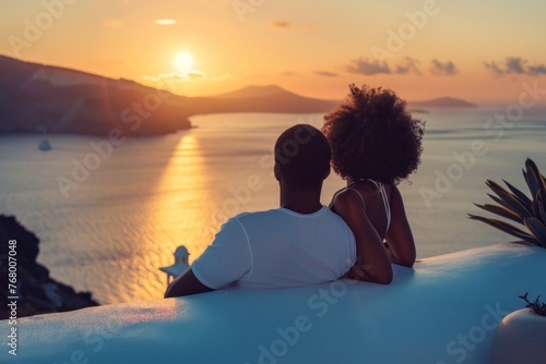 Romantic sunset view from a Santorini balcony  ideal for honeymoon travel. Luxury lifestyle getaway in Greece with ocean view.
