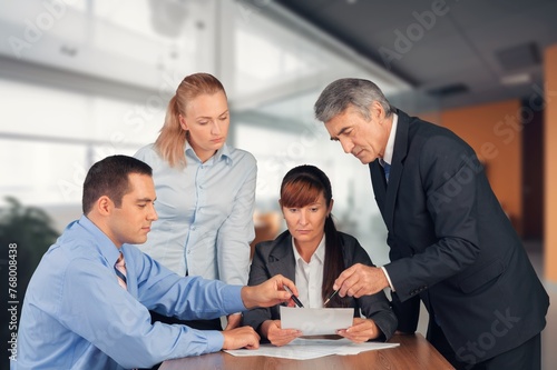 Group of smiling businesspeople work together