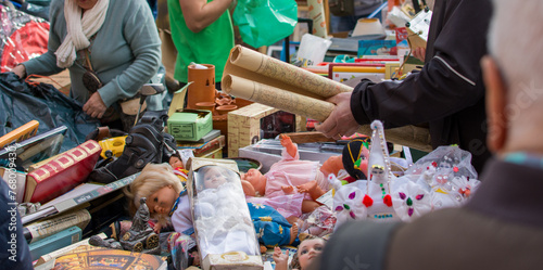 A person looking for some second hand old things in a flea market photo