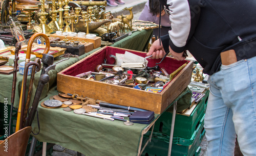 A person looking for some second hand old things in a flea market