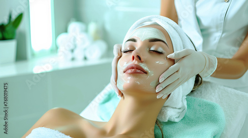 A young, spectacular, woman undergoes treatments at a spa center.