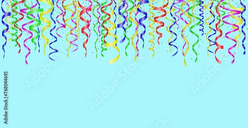 Falling confetti and curly colorful shiny streamer on blue background. Empty space for text