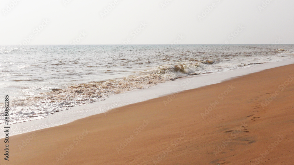 The foam of turbulent wave on the beach at Veli, Thiruvananthapuram, Kerala, India