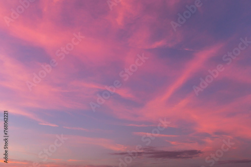 Pink purple violet blue cloudy sky. Beautiful epic sunrise, sunset with cirrus clouds abstract background texture © Viktor Iden