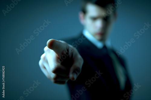 A Focused Businessman in a Suit with a Blurred Background