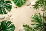 A serene arrangement of lush green tropical leaves and assorted smooth white stones on a soft beige background, invoking a sense of calm and natural beauty