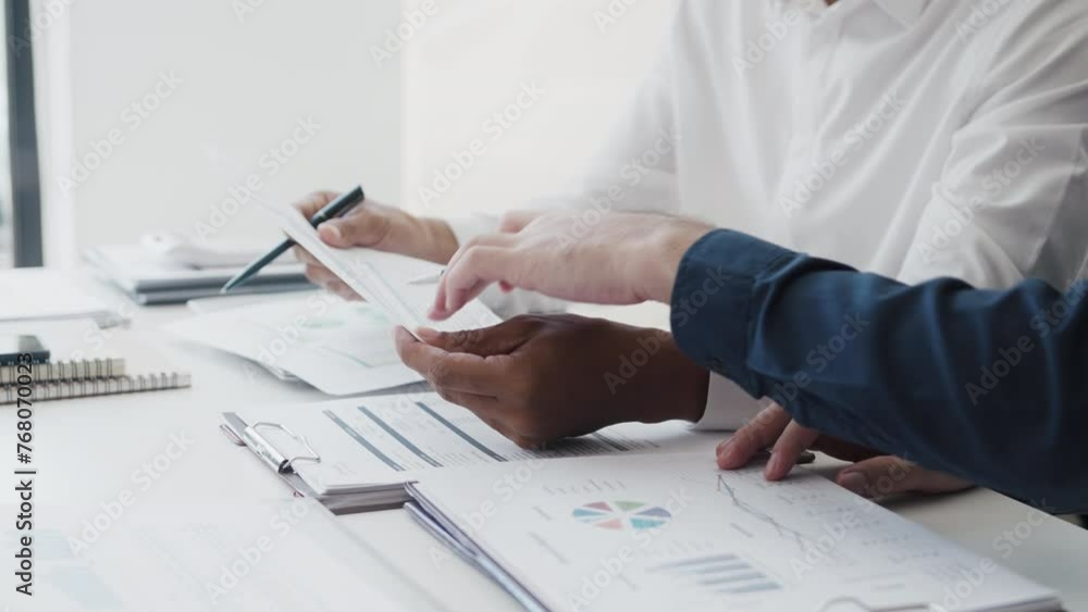 Business startup cooperation brainstorming on data documents in modern creative office Business startup cooperation brainstorming on data documents in modern creative office