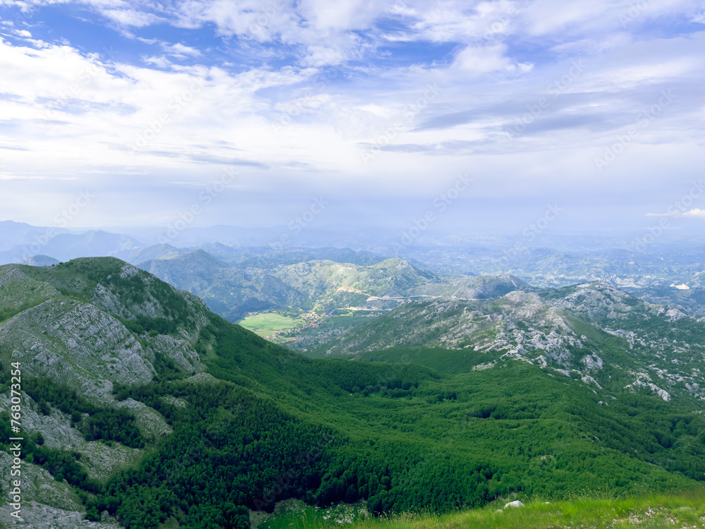 Lovcen national park aerial landscape with clouds in the mountains at summer view