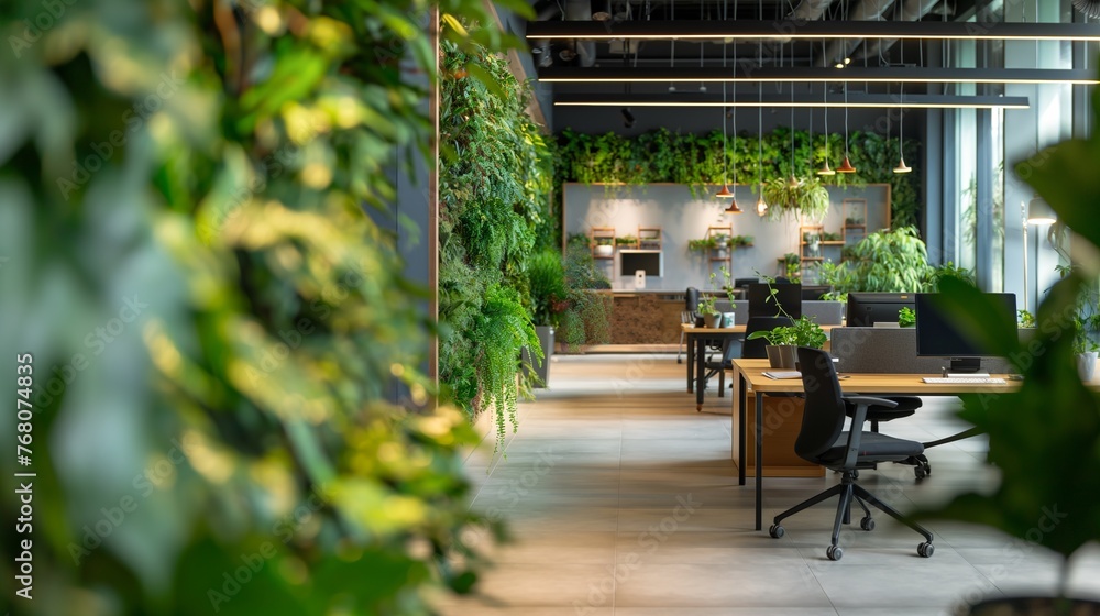 Modern office space with lush green plants in pots. Innovative startup company with green, ecofriendly environment with lush vegetation in workplace. Productive and healthy work place. 