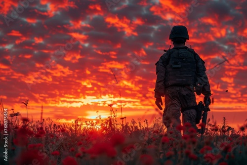 A solemn tribute: The soldier silhouette against a sunset serves as a powerful symbol of respect and remembrance for those who gave all. photo