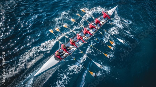 Drone captures panoramic view of synchronized canoe rowing team competing in vast blue sea photo