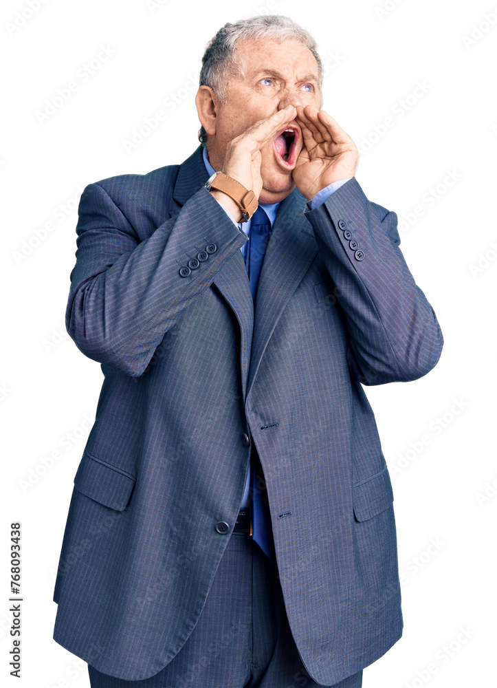 Senior grey-haired man wearing business jacket shouting angry out loud with hands over mouth Senior grey-haired man wearing business jacket shouting angry out loud with hands over mouth