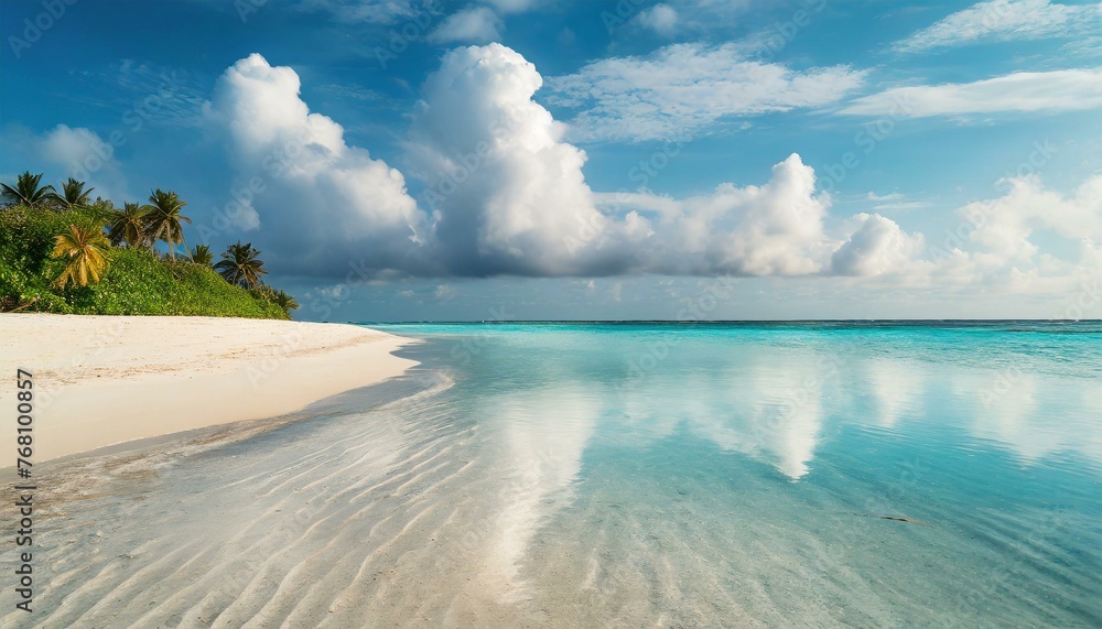 Beautiful sandy beach with white sand and rolling calm wave of turquoise ocean on Sunny day. White clouds in blue sky are reflected in water. perfect scenery landscape, copy space 