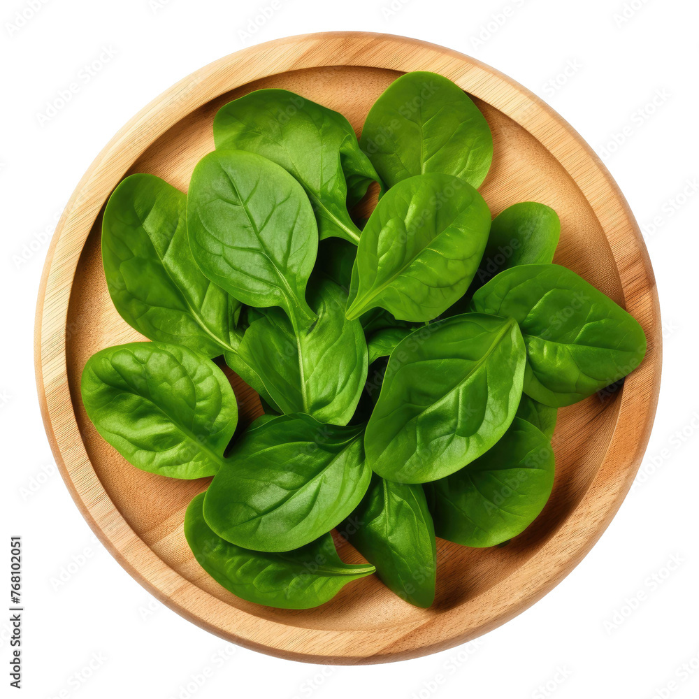 wooden round plate with fresh spinach leaves, isolated on a white background. top view wooden round plate with fresh spinach leaves, isolated on a white background. top view