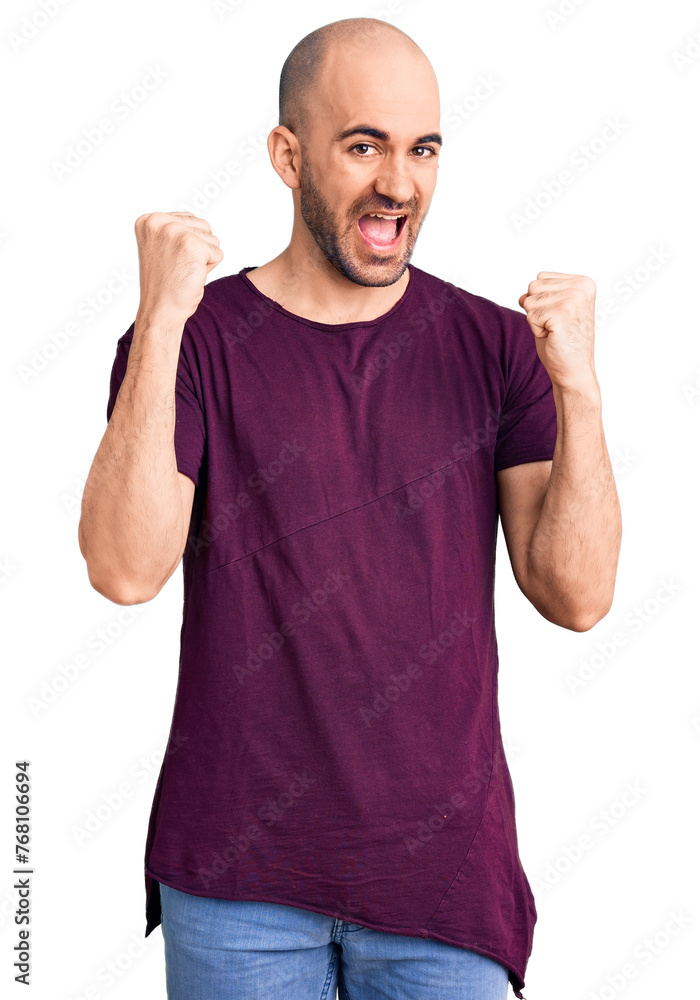 Young handsome man wearing casual t shirt screaming proud, celebrating victory and success very excited with raised arms Young handsome man wearing casual t shirt screaming proud, celebrating victory and success very excited with raised arms