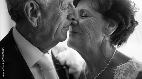 A monochrome closeup of an elderly couple in formal attire, their faces reflecting a profound and dignified love. Golden wedding anniversary celebration. Grannie and grandpa wedding. 50 years together