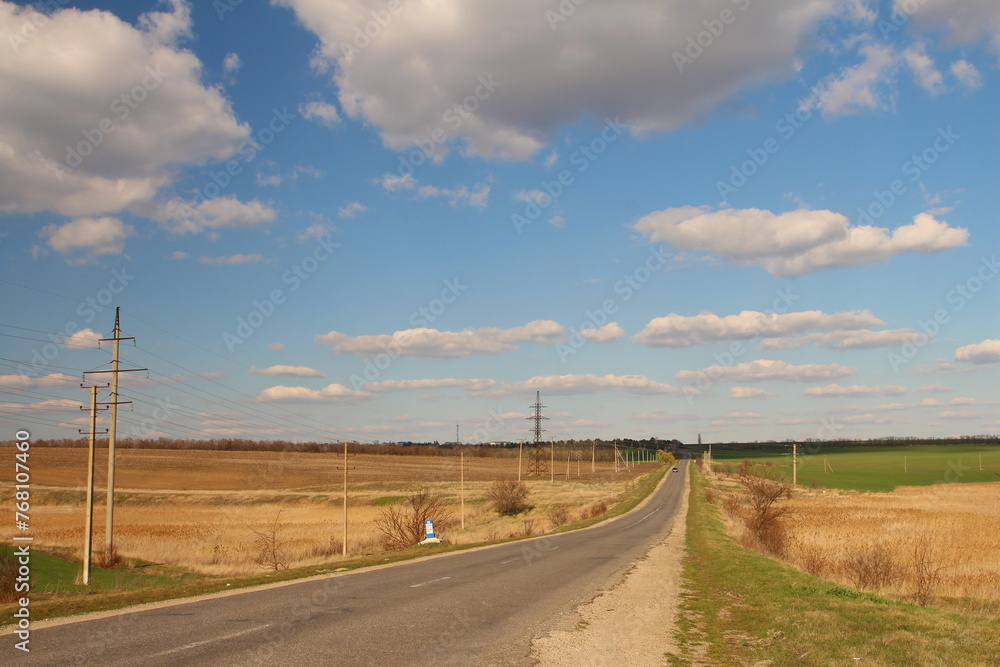 A road with power lines on the side