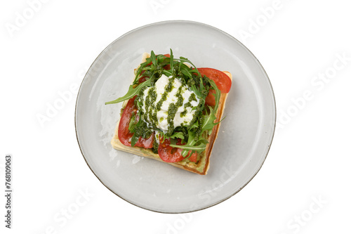 waffle with egg, tomatoes and herbs, cut out, top view photo