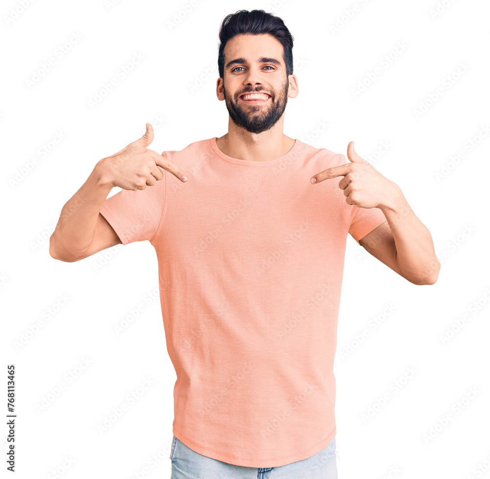 Young handsome man with beard wearing casual t-shirt looking confident with smile on face, pointing oneself with fingers proud and happy. - obrazy, fototapety, plakaty 