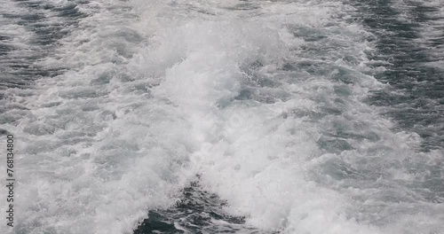 Ship wake up in the ocean. aves from the back of a speed boat over the water's surface in the sea. Waves behind a boat on a clear blue sea