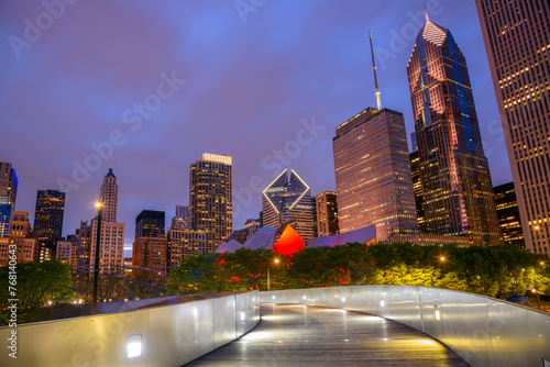 Nigh view of Chicago  skyline as seen from an illuminated winding walkway over Millennium Park