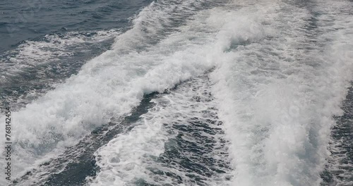 Ship wake up in the ocean. aves from the back of a speed boat over the water's surface in the sea. Waves behind a boat on a clear blue sea